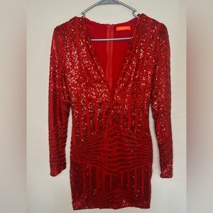 Beautiful red suit with glitter and front neckline.